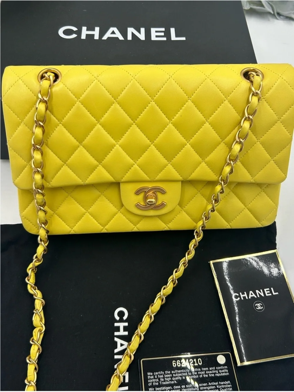 Women’s Chanel, classic quilted double flap bag in yellow with Gould hardware